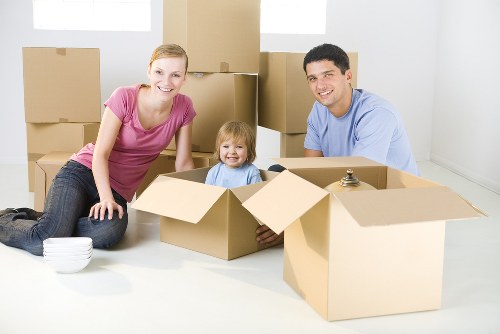 Home removals team handling furniture in southwest London
