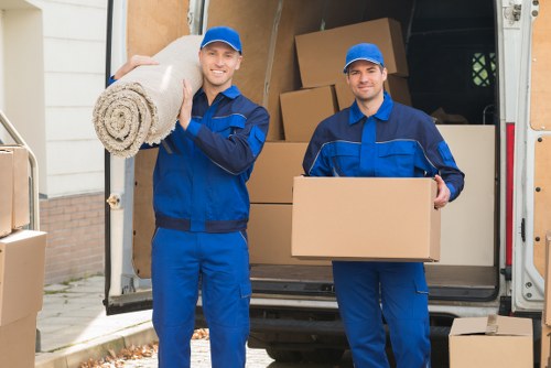 Removal team loading furniture for a Mortlake home move