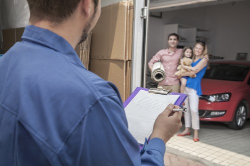 Local removals team preparing a move in Mortlake with boxes and furniture