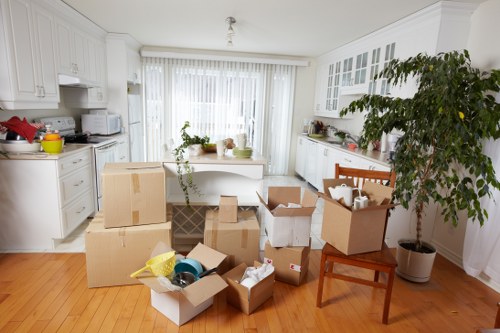 Packed moving boxes ready for man and van removals in Mortlake