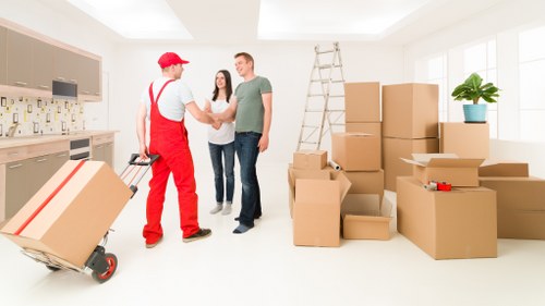 Careful loading of furniture into a moving van in Mortlake