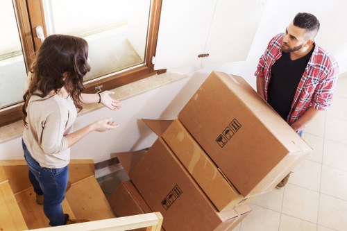 Professional movers handling furniture in Mortlake