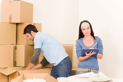 Unpacking boxes in a newly moved-into Mortlake property